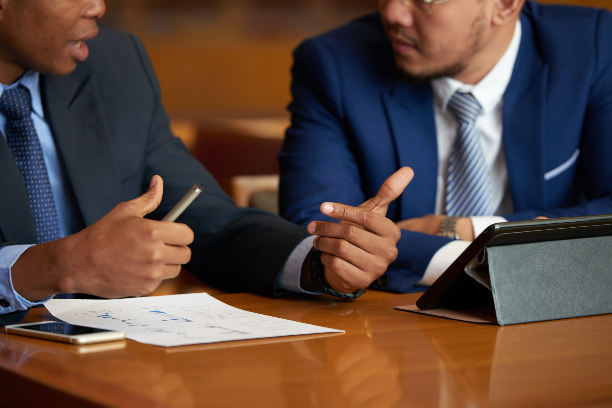 Discussing busines report Compensation Lawyers