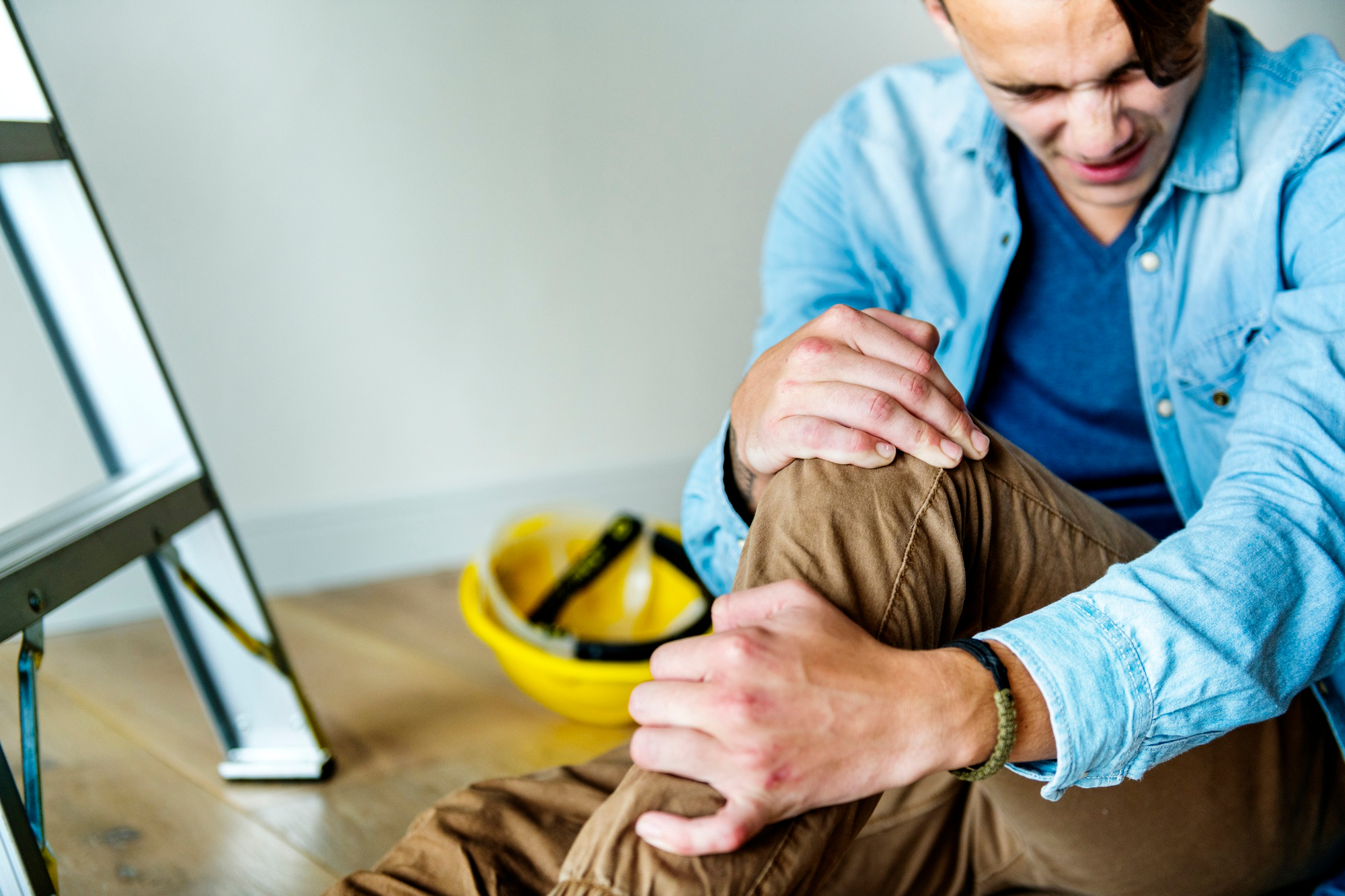 worker suffering from strained leg